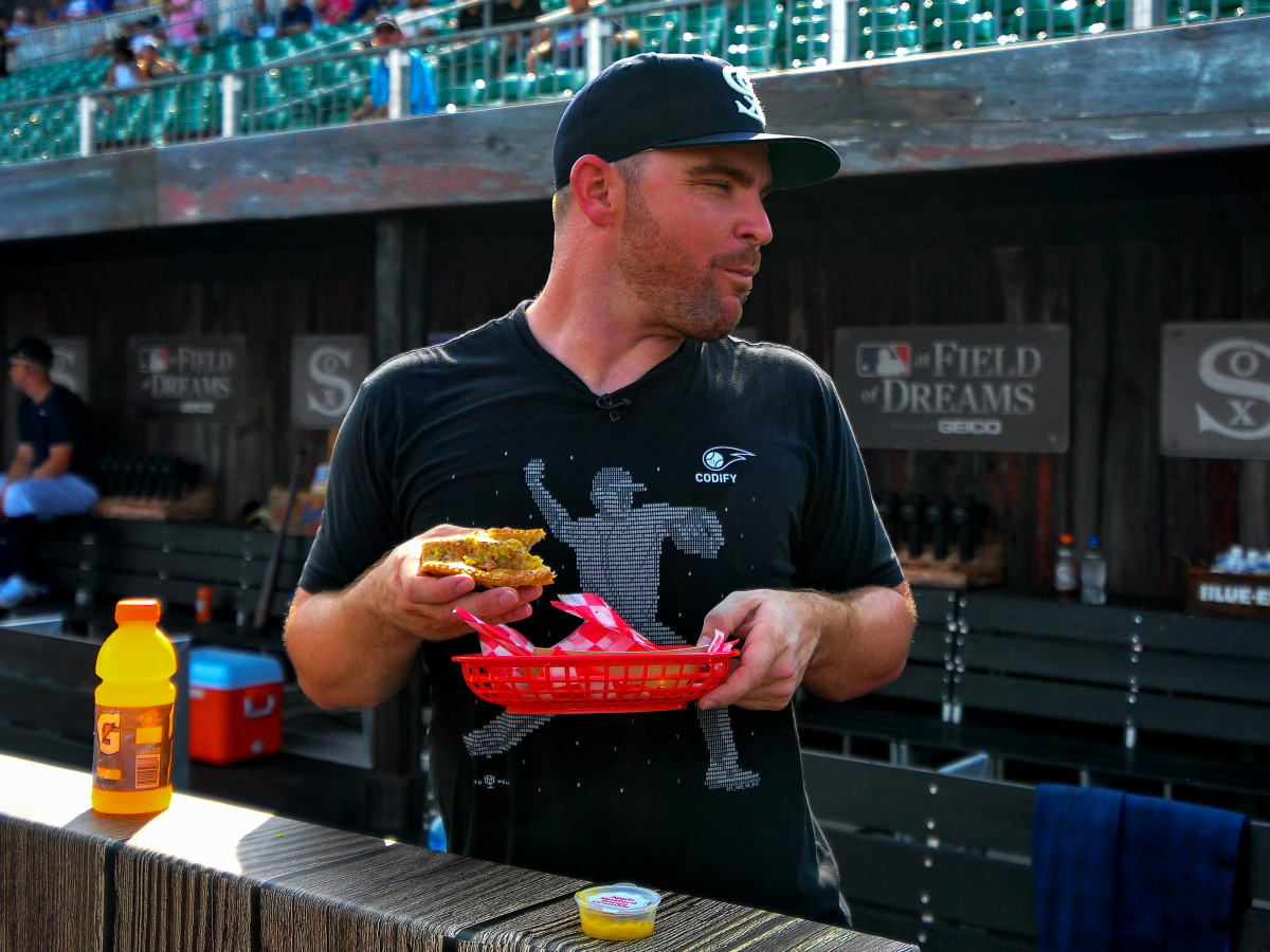Aug 12, 2021; Dyersville, Iowa, USA; Chicago White Sox relief pitcher Liam Hendriks (31) takes in a meal before the game between the Chicago White Sox and the New York Yankees at Field of Dreams.
